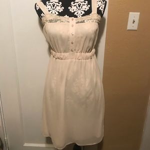 Very flattering, modest, tan dress.